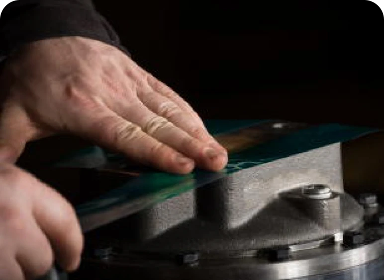 Close-up of blade being sharpened manually
